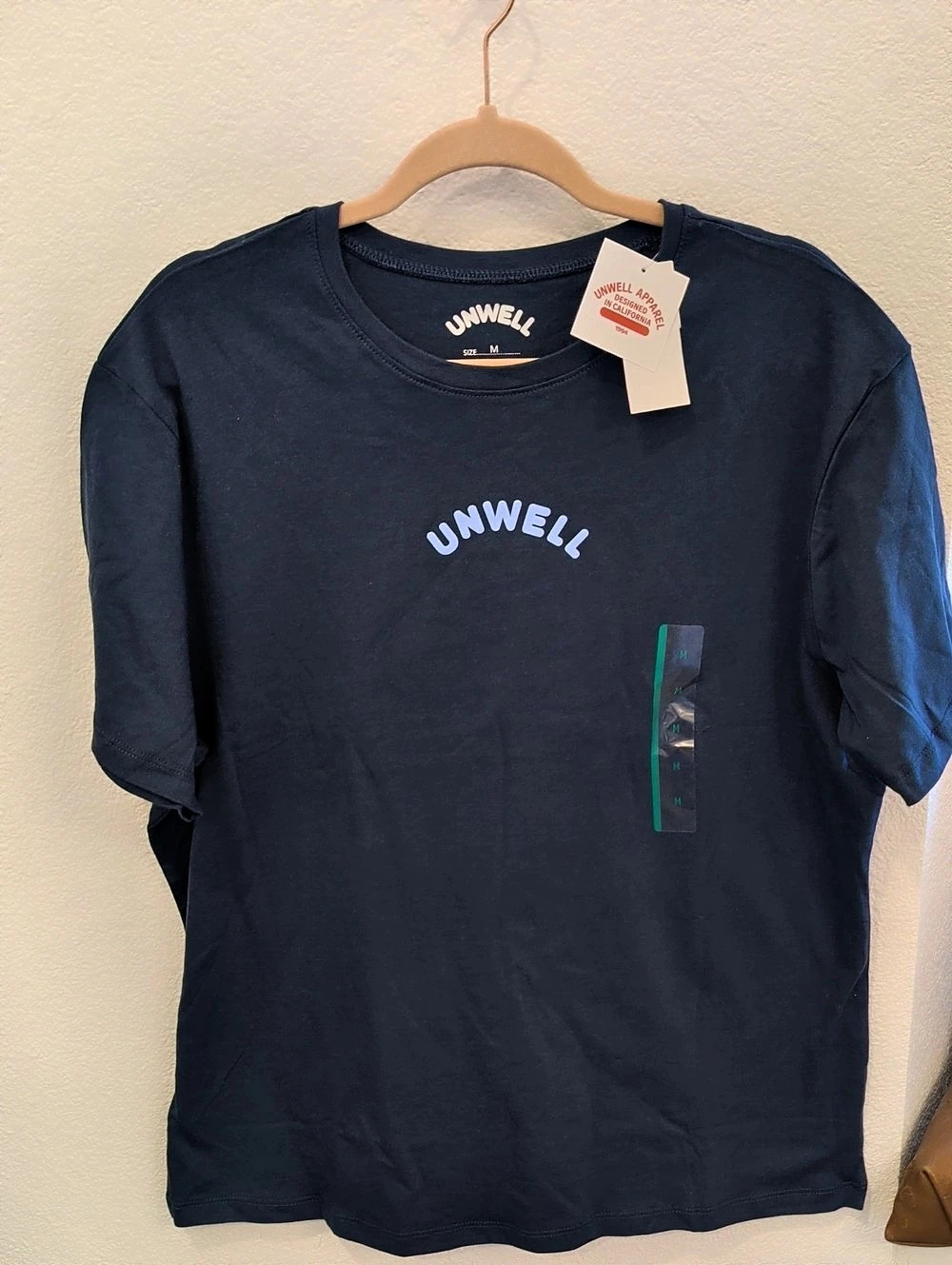 Unwell Apparel Designed in California Est. 23 graphic tee Graphic Tee in Blue